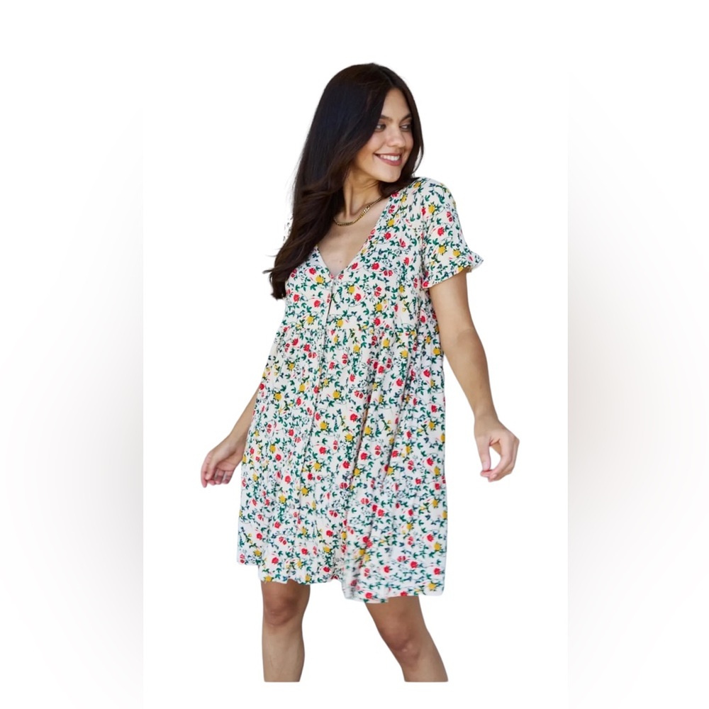 Ninexis Follow Me v neck swing dress floral print with ruffled hem. Size M